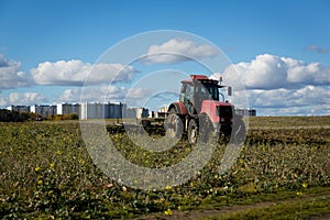 Agricultural machinery, prepares the land with a cultivator. Plowing a tractor