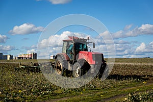 Agricultural machinery, prepares the land with a cultivator. Plowing a tractor