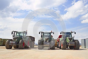 Agricultural machinery. Three heavy industrial tractors view