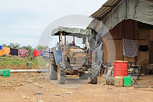 Agricultural motorcycle beside Farmer work house