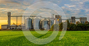 Agricultural Silos - Building Exterior, Storage and drying of grains, wheat, corn, soy, sunflower against the blue sky