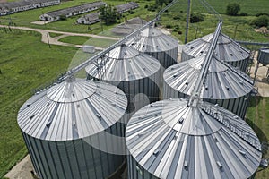 Agricultural silos on the farm, close-ups from above with a drone. Farm Industrial granary, elevator dryer, building exterior