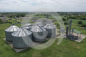 Agricultural silos on the farm, close-ups from above with a drone. Farm Industrial granary, elevator dryer, building exterior,
