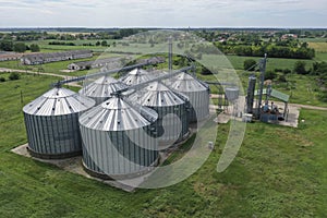 Agricultural silos on the farm, close-ups from above with a drone. Farm Industrial granary, elevator dryer, building exterior,