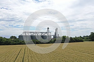 Agricultural silos on a farm, photos from above with a drone. Industrial agricultural granary, processing plant, elevator dryer