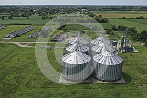 Agricultural silos on a farm, photos from above with a drone. Industrial agricultural granary, processing plant, elevator dryer,