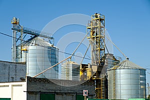 Agricultural Silos. Storage tanks agricultural crops processing plant. Granary elevator. Agribusiness concept