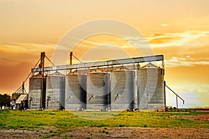 Agricultural silos at sunset