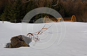 Agricultural tool in a field in witer in Canada, Quebec photo