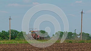 Agricultural Tractor With Seeder Sowing Crops In
