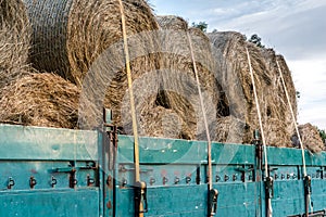 Agricultural trailer with tied hay bales