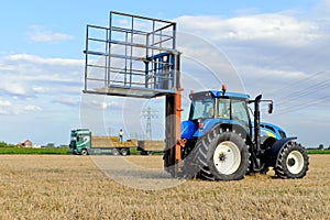 Agricultural traktor with hay bails
