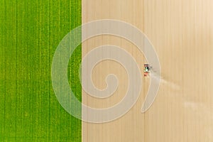 Agricultural transport. Tractor in the field. Working the land. Aerial view of the field. Landscape from a drone.