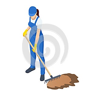 Agricultural work. Woman working in garden with rake leveling ground. Soil preparation for seeding and planting, garden