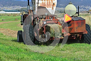 Agriculture: Baler at work in field