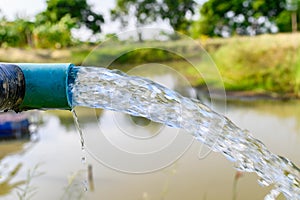 Agriculture blue pipe with groundwater gushing