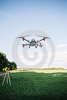 Agriculture drone fly to sprayed fertilizer on the rice fields. Industrial agriculture