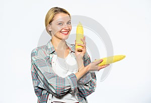 Agriculture and fall crops concept. Fall harvest concept. Woman farmer hold yellow corn cob on white background. Girl