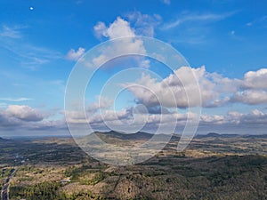 Agriculture fields from aerial with blue sky and white clouds