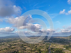 Agriculture fields from aerial with blue sky and white clouds
