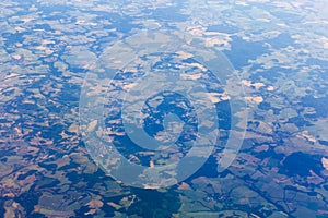 Agriculture fields and hill landscape view from an airplane