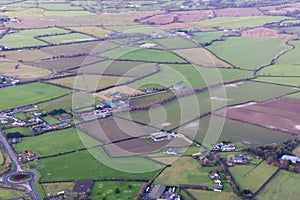 Agriculture fields and hill landscape view from an airplane 