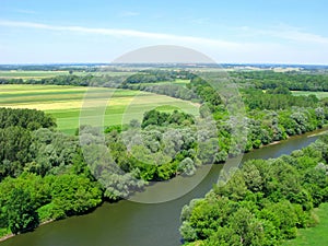 Agriculture, fields in wooded area, Morava river, top view