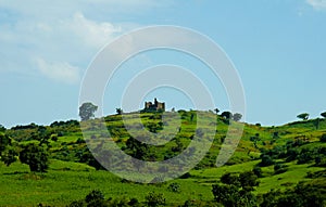 Agriculture landscape with Guzara castle and fields of teff in Ethiopia