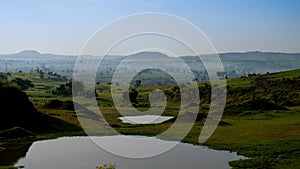 Agriculture landscape with ponds and fields of teff in Ethiopia