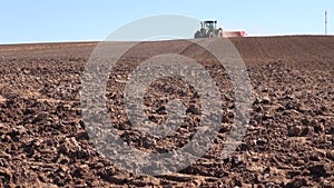 Agriculture tractor with machine sowing seeds