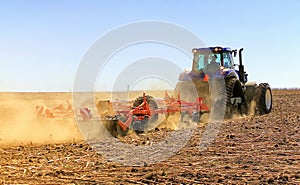 Agriculture. The tractor prepares the ground for sowing and cult
