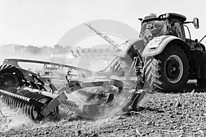 Agriculture. The tractor prepares the ground for sowing and cult