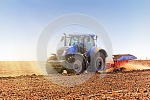 Agriculture. The tractor prepares the ground for sowing and cultivation. Agronomy, the concept of farming. Agricultural machinery