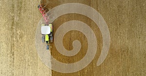 AGRICULTURE - Wide shoot of tractor plowing field 4K