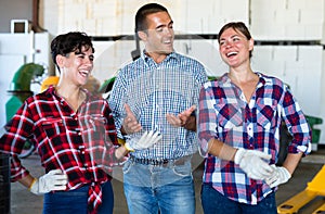 Agriculturists having conversation in facility