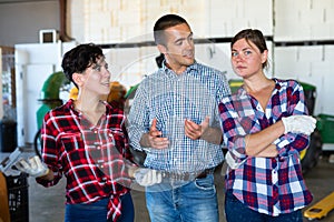 Agriculturists having conversation in facility