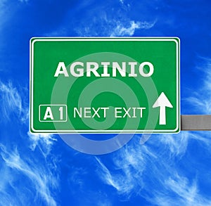 AGRINIO road sign against clear blue sky