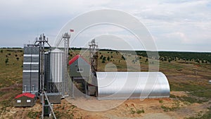 Agro industrial technical buildings hangars and grain dryers on the collective farm field