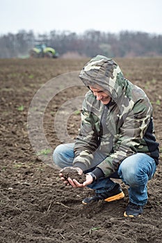 Agronomist checks the soil moisture before sowing cereals