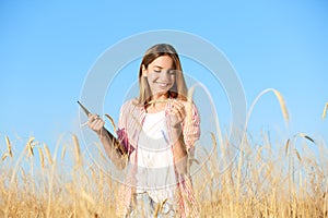 Agronomist with clipboard in field. Cereal grain crop