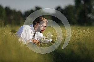 Agronomist on field with tablet