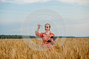 Agronomist holding test tube with barley grains in field, closeup. Cereal farming, oncept of wheat testing