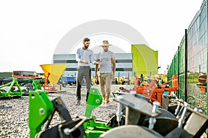 Agronomist with salesman at the agricultural shop