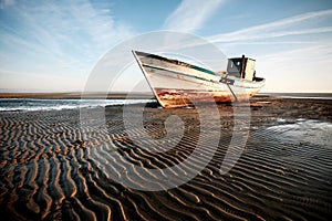 Aground boat on the beach