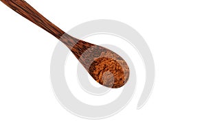 Aguaje flour in wooden spoon, close-up. Healthy ingredient for Aguajina drink, buriti wine and chupetes. Aguaje powder strong photo