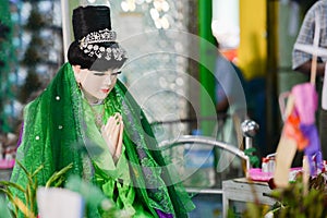 Ahmagyi Mya Nan Nwe, a devotee to the Botahtaung Pagoda. She was known as dragon guarding the pagoda. Hundreds of people come to photo