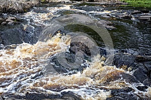 Ahvenkoski Waterfall on the stormy Tohmajoki River