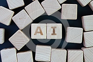 AI, Artificial Intelligence or machine learning in future world concept, straggle cube wooden blocks with some combine the word AI