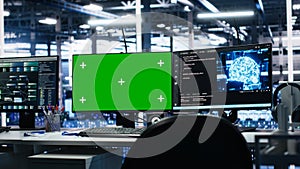 AI development workstations in data center with green screen monitors