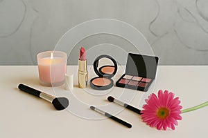 Assorted cosmetics and beauty items arranged on a table
